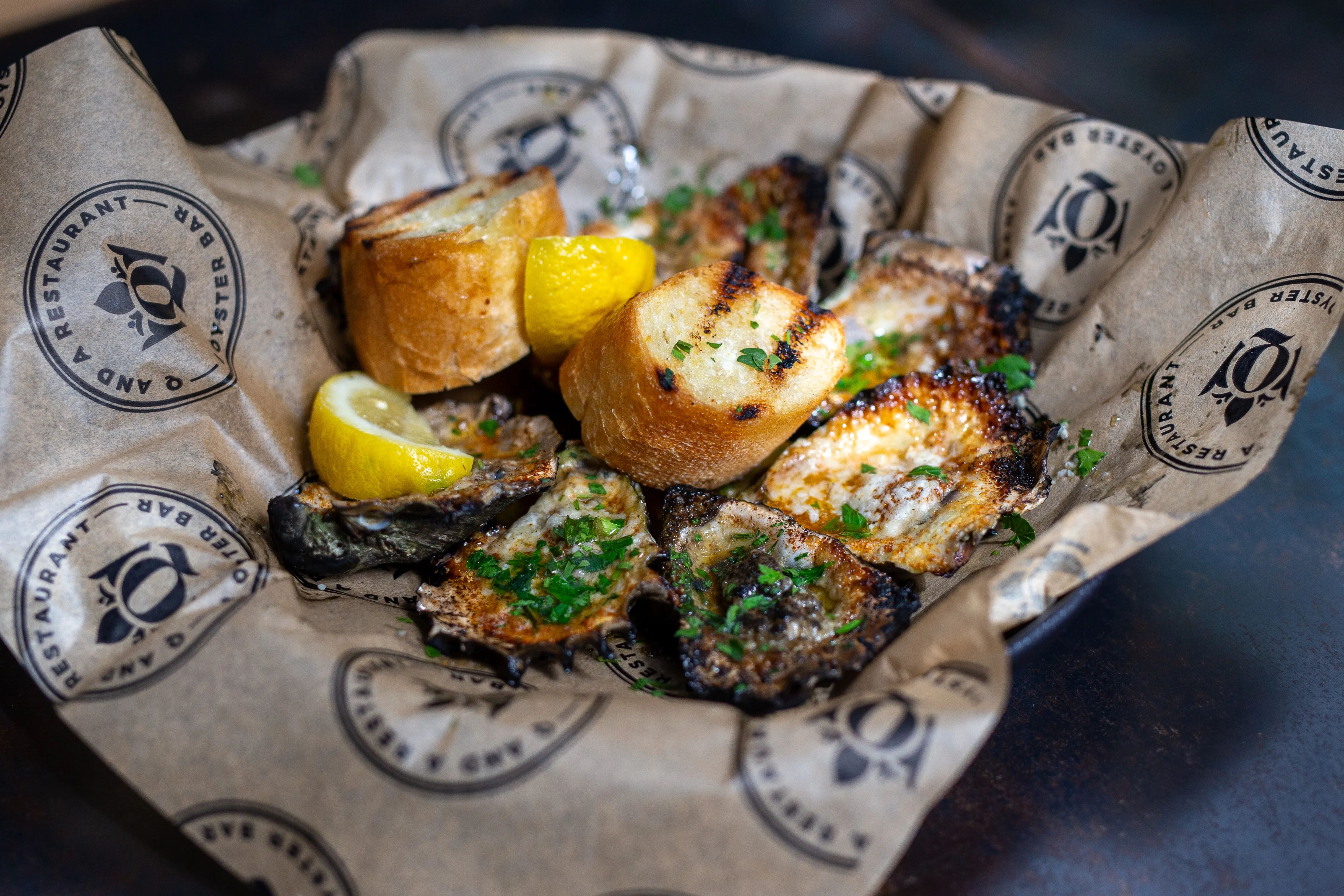 chargrilled gulf oysters, garlic lemon butter, parmesan