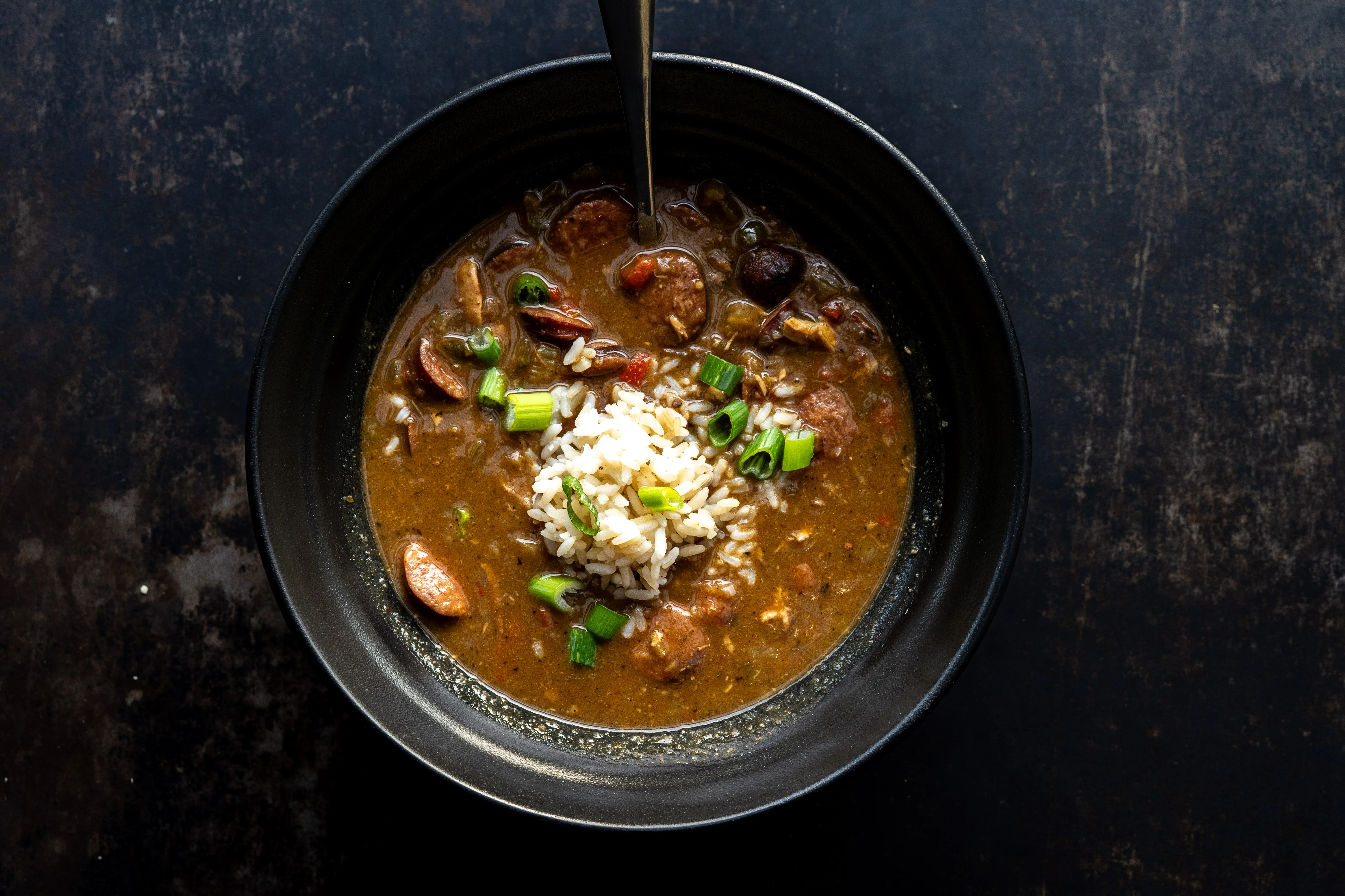 jumbo shrimp · crawfish · andouille · dark roux · okra · rice