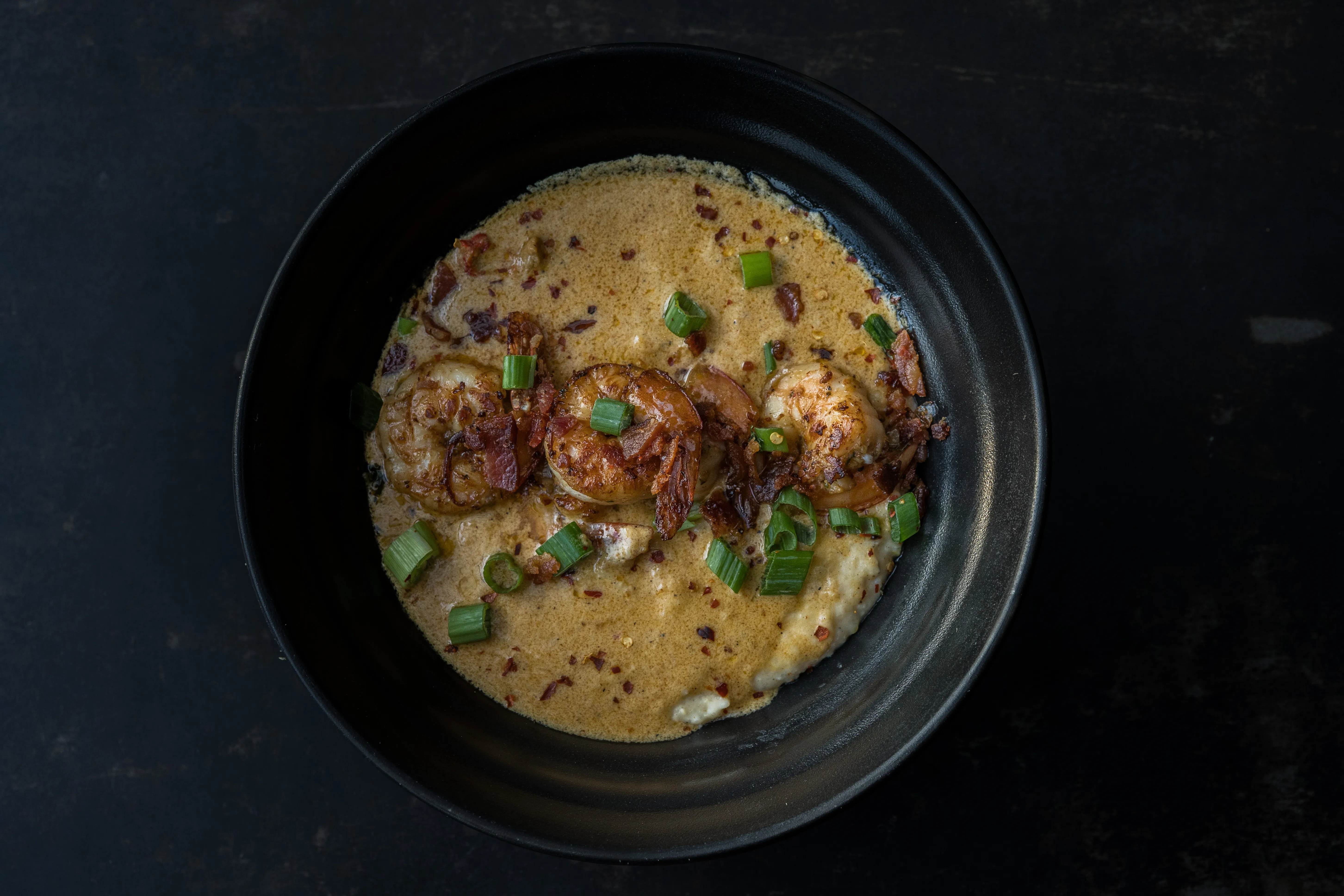 gulf shrimp · crawfish cream · creole grits · bacon · green onion