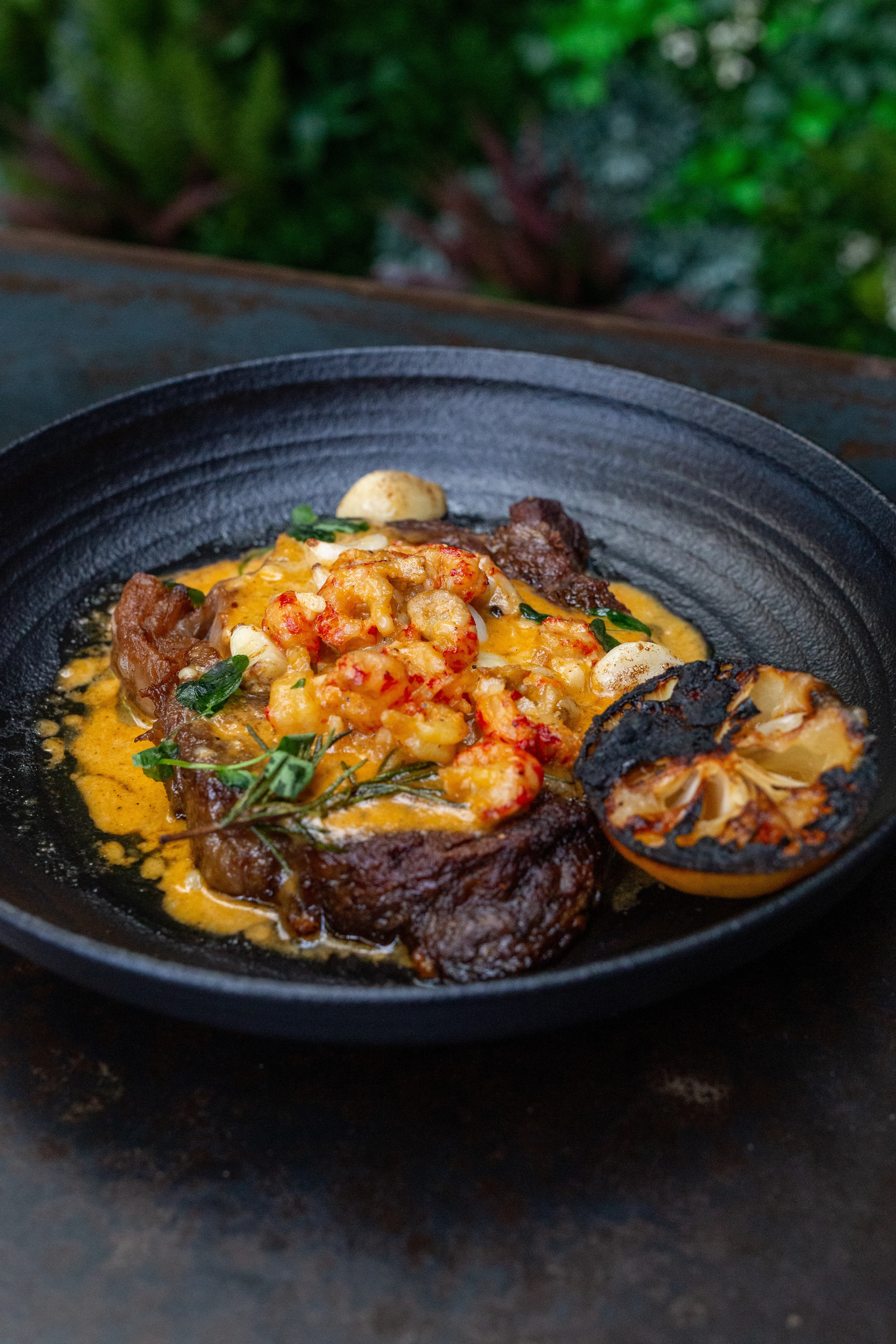 14oz ribeye · crawfish cream sauce · grated parmesan