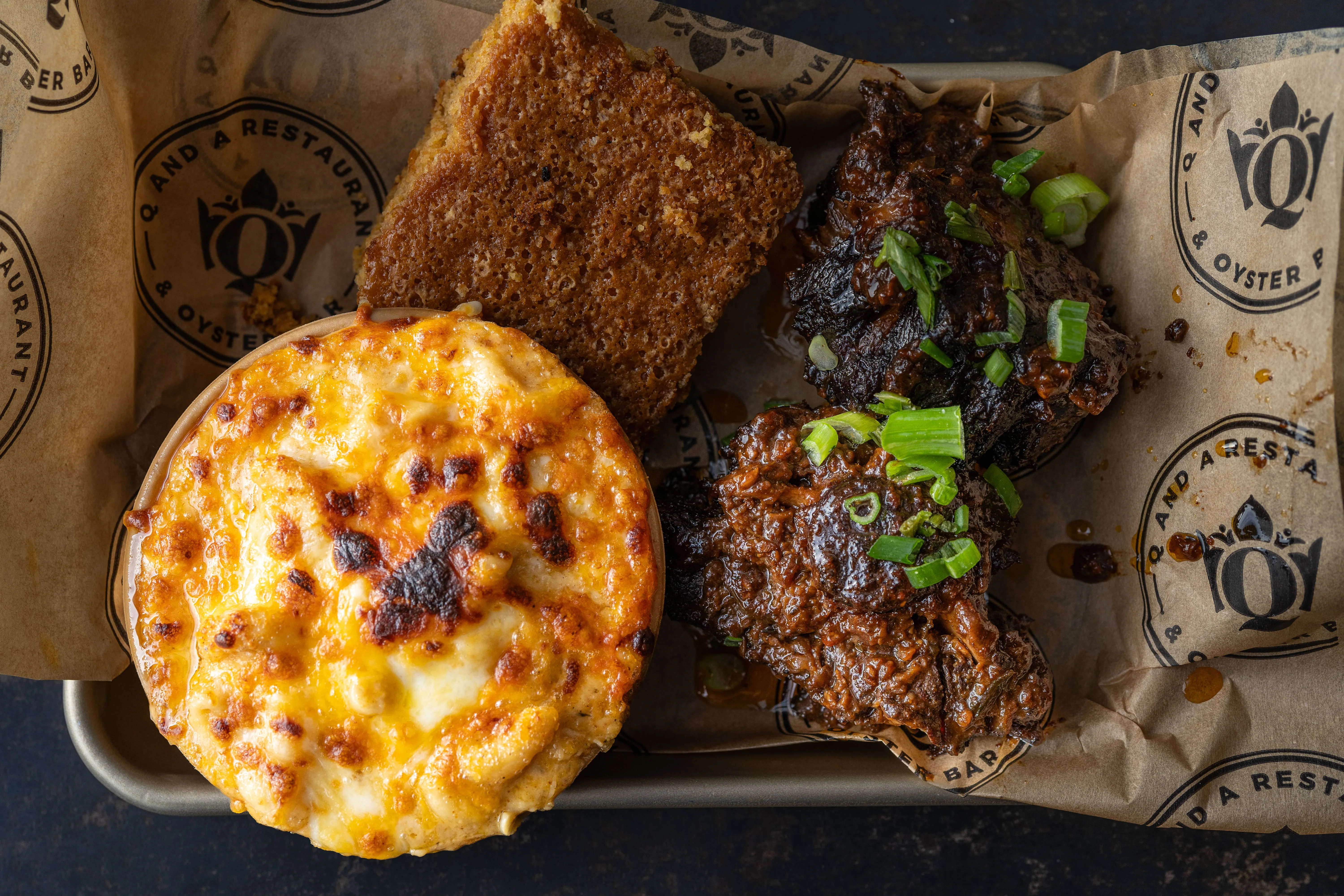 8oz braised oxtail with smoked gouda mac and sweet potato cornbread at Louisiana Purchase