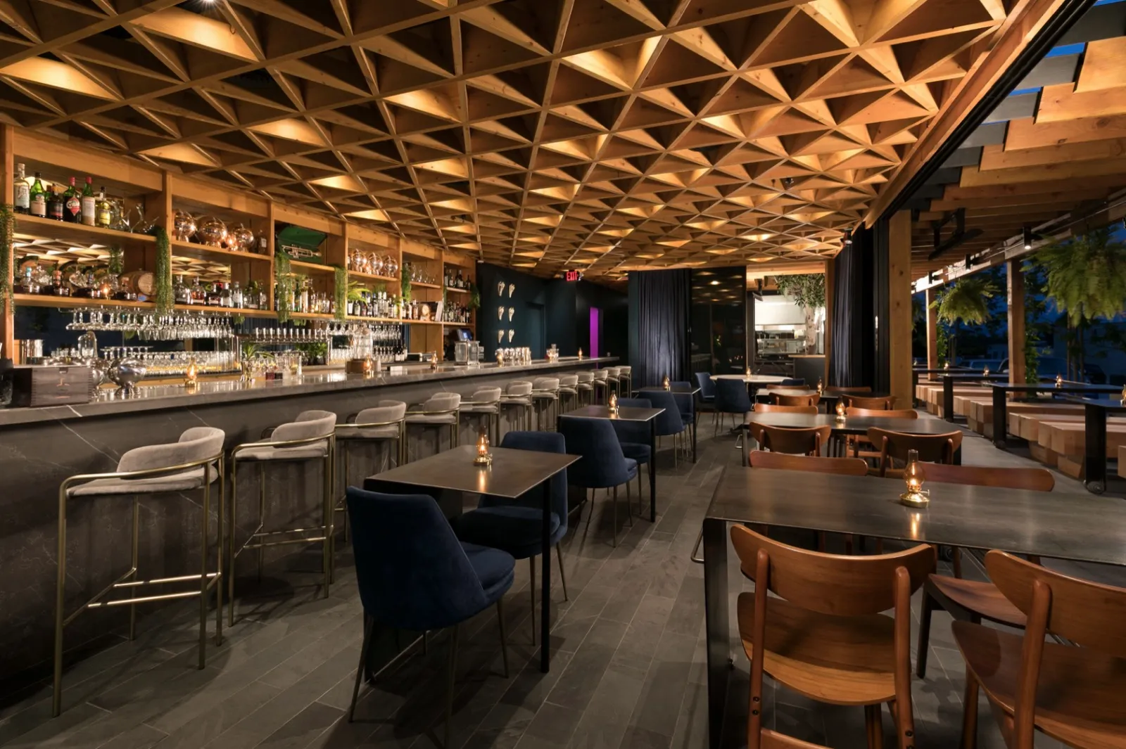 Louisiana Purchase interior — geometric timber ceiling, marble bar, velvet seating