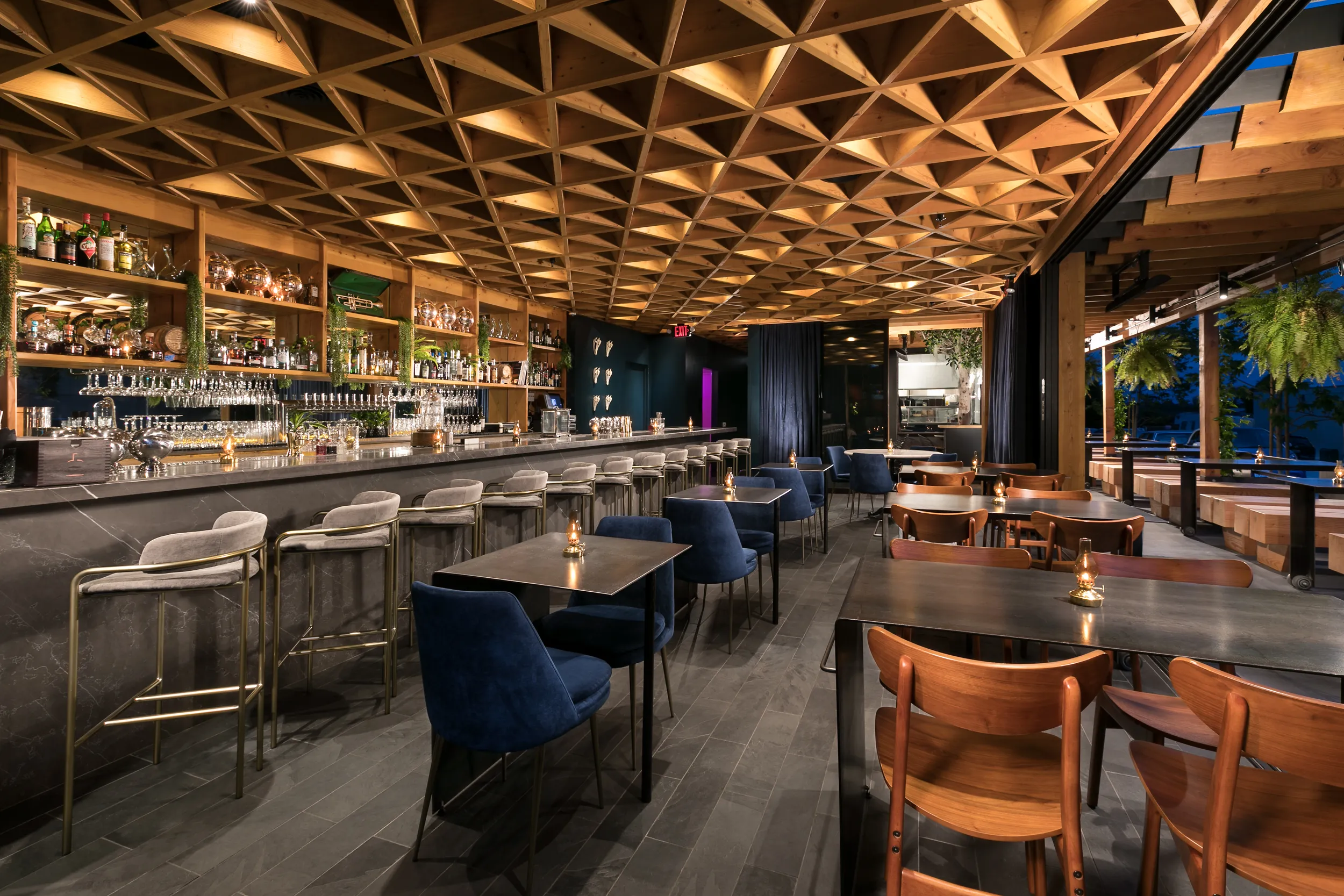 Louisiana Purchase dining room — geometric timber ceiling and marble bar