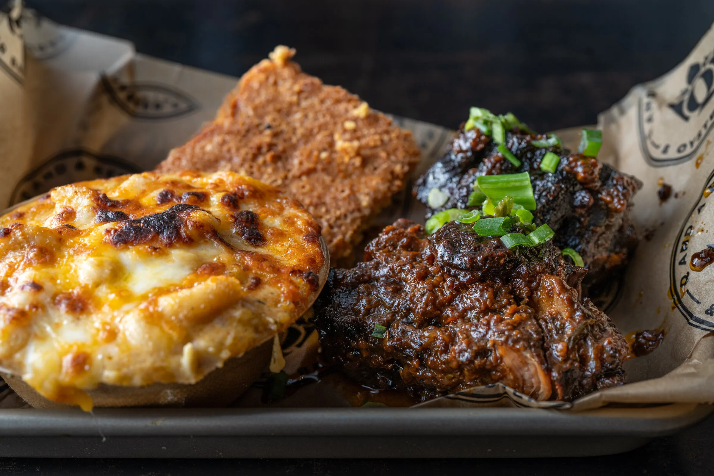 Oxtail Plate — braised oxtail with smoked gouda mac and sweet potato cornbread at Louisiana Purchase